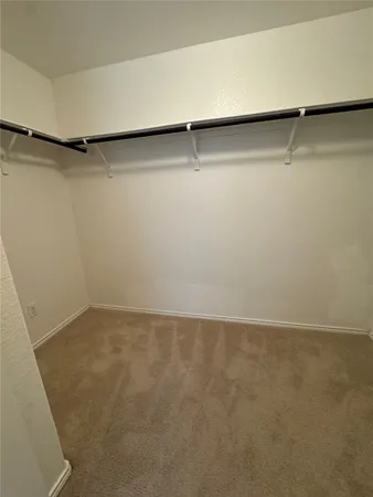 a bathroom with a glass door and shower