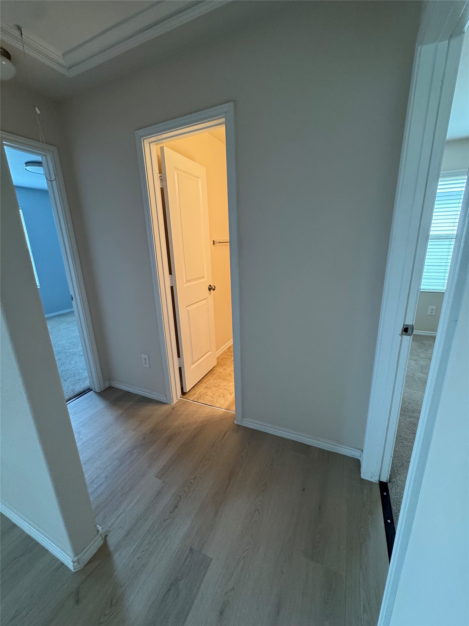 1108 Jackson Lane, Unit 5B Jarrell, TX 76537 - Photo 14 of 29 Corridor featuring light wood-style flooring and baseboards