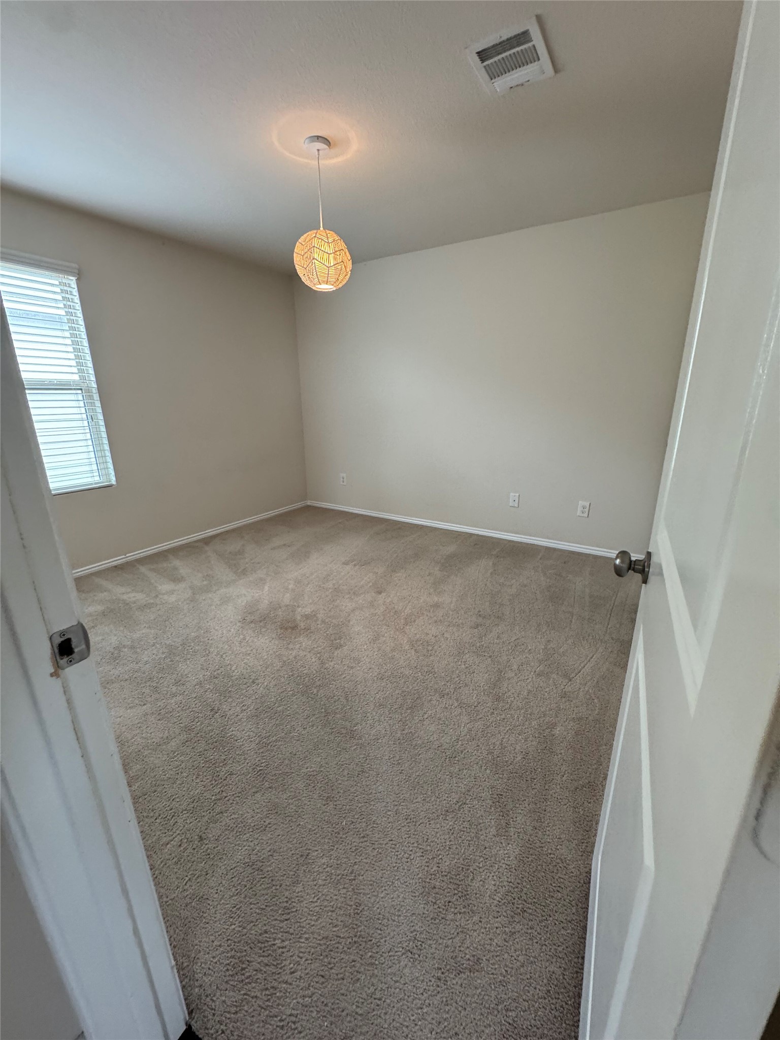 1108 Jackson Lane, Unit 5B Jarrell, TX 76537 - Photo 20 of 29 Empty room with light colored carpet and baseboards