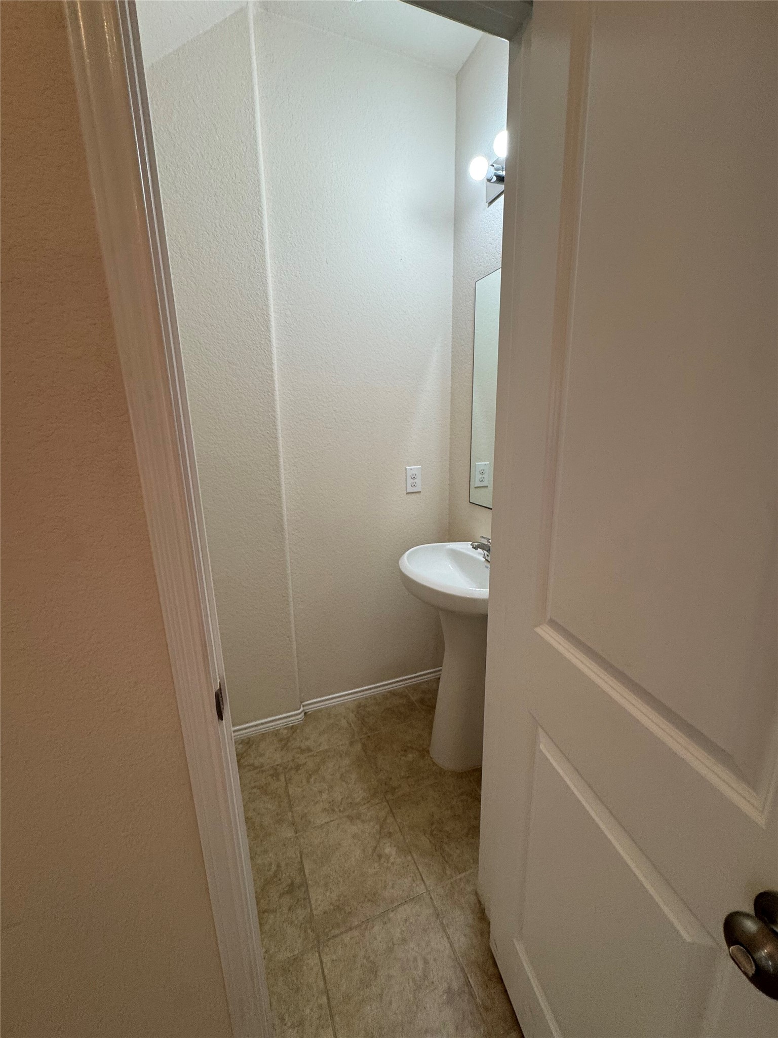 1108 Jackson Lane, Unit 5B Jarrell, TX 76537 - Photo 22 of 29 Half bathroom featuring baseboards