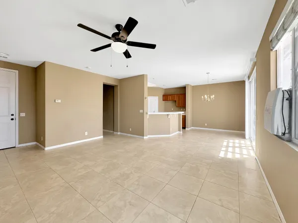 a view of empty room with a ceiling fan