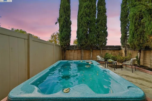 a view of a backyard with sitting area