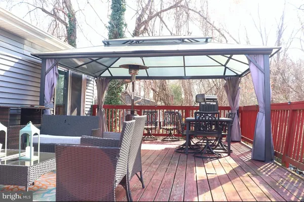 a view of balcony with chairs and wooden floor