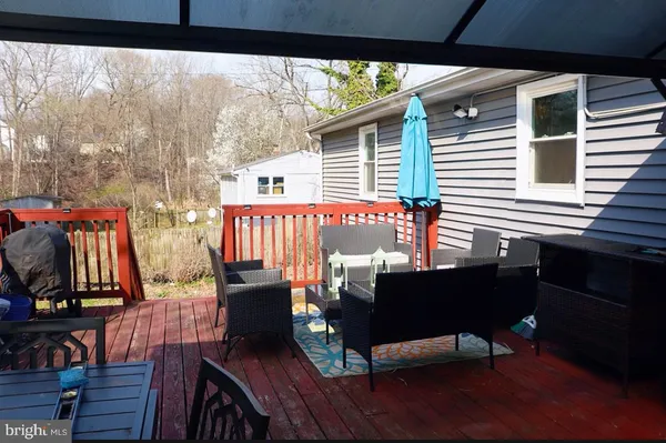 a view of a chairs and table in the balcony