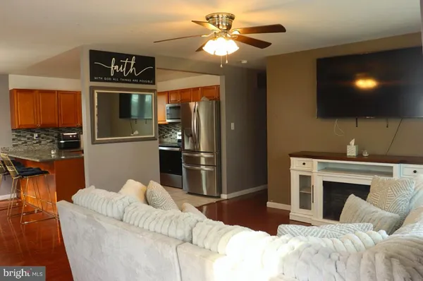 a bedroom with a bed and a television