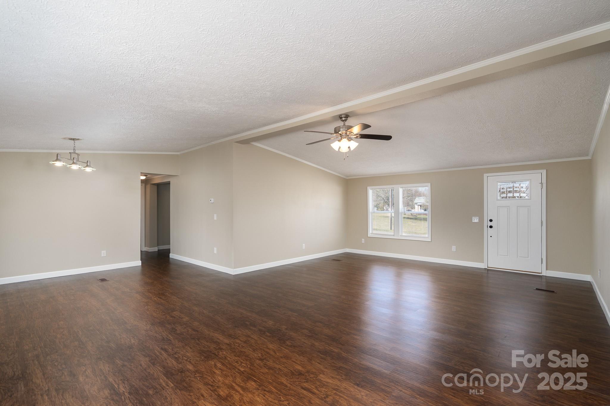 7536 Beaver Road Kannapolis, NC 28081 - Photo 8 of 41 a view of an empty room with window and wooden floor