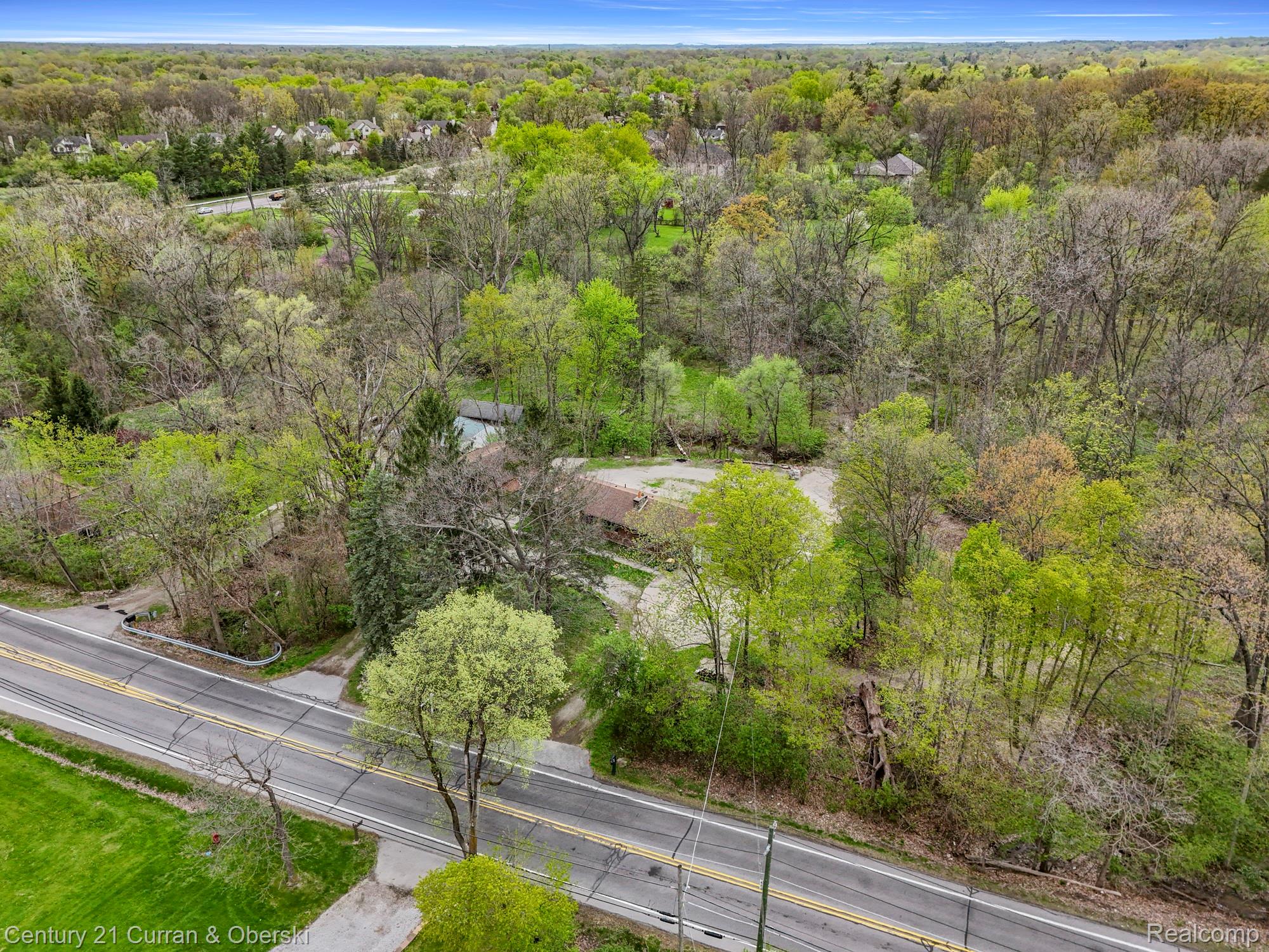 25205 Inkster Road Farmington, MI 48336 - Photo 46 of 46 Drone / aerial view of a heavily wooded area
