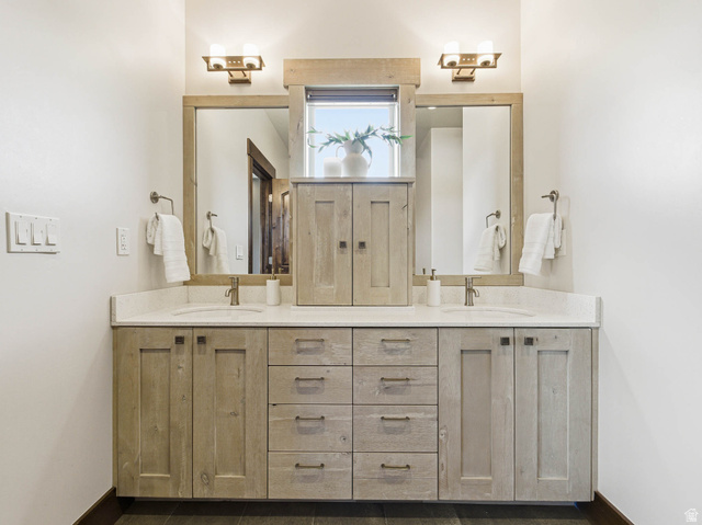 402 Shadow Hill Road Wanship, UT 84017 - Photo 26 of 90 Bathroom featuring double vanity and baseboards