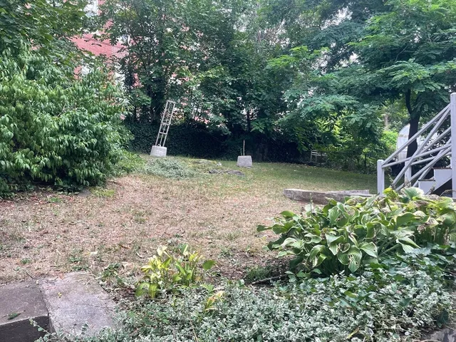 a backyard of a house with lots of green space