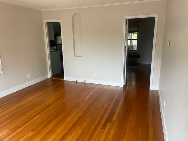 wooden floor in a hall with an entryway