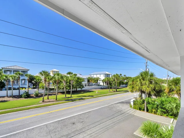 a view of a big yard with potted plants