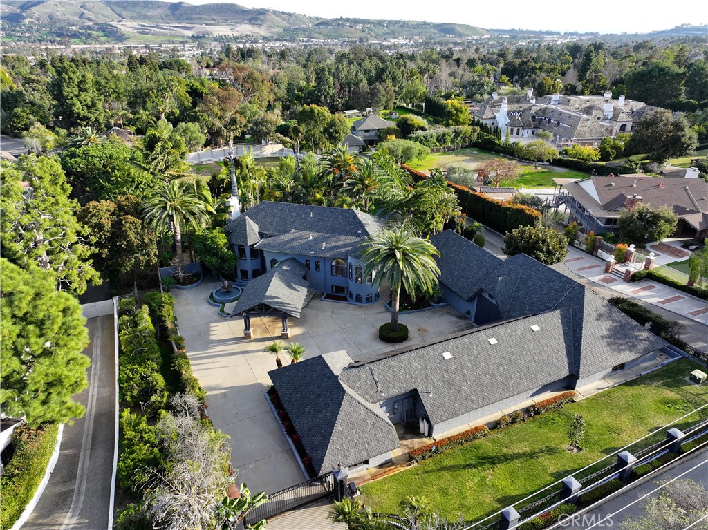 31589 Aguacate Road San Juan Capistrano, CA 92675 - Photo 1 of 1 an aerial view of a house with a yard