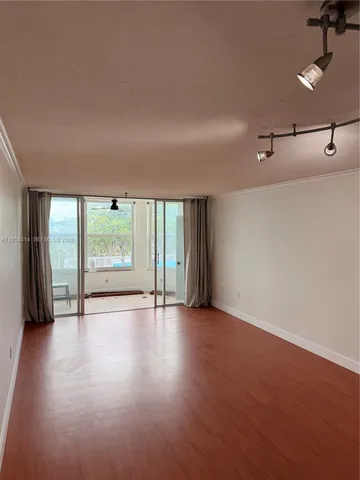 a view of an empty room with a window