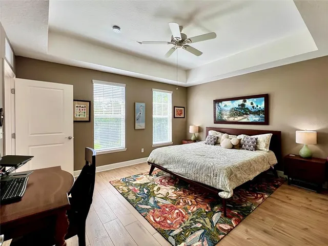 a bed room with a bed window and a dresser