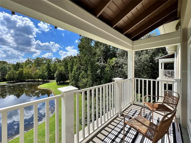 a view of a two chairs in the balcony