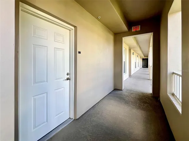 a view of a hallway with windows