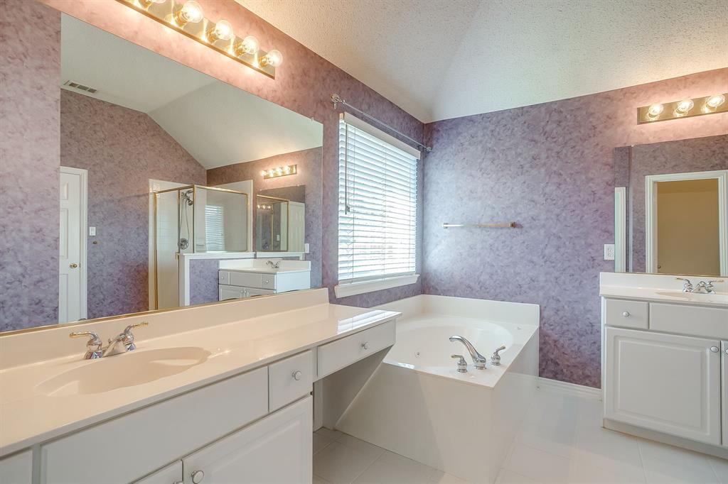 8105 Hosta Way Fort Worth, TX 76123 - Photo 23 of 33 a bathroom with a bathtub sink and mirror