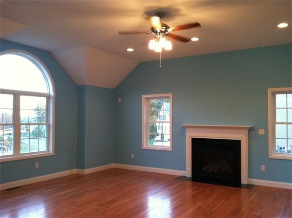 33 Beechnut Road Dracut, MA 01826 - Photo 19 of 30 an empty room with windows fireplace and wooden floor