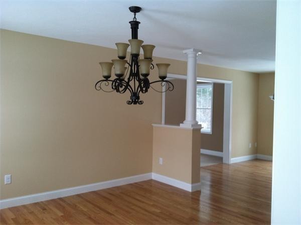 33 Beechnut Road Dracut, MA 01826 - Photo 25 of 30 a view of a room with wooden floor and chandelier