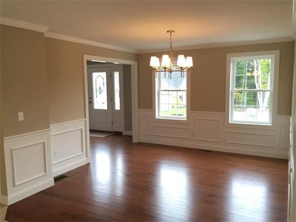 33 Beechnut Road Dracut, MA 01826 - Photo 28 of 30 an empty room with wooden floor and windows