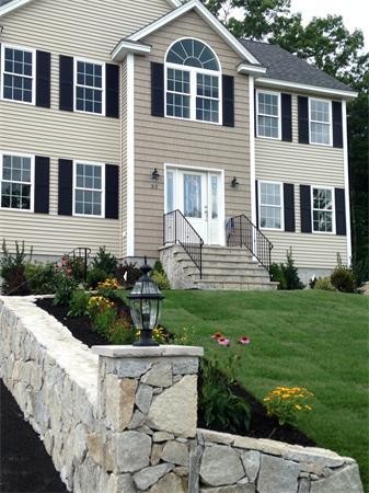 33 Beechnut Road Dracut, MA 01826 - Photo 29 of 30 a front view of a house with a yard