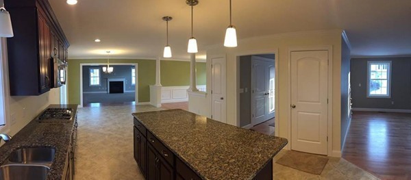 33 Beechnut Road Dracut, MA 01826 - Photo 4 of 30 a view of a hallway with wooden floor and chandelier