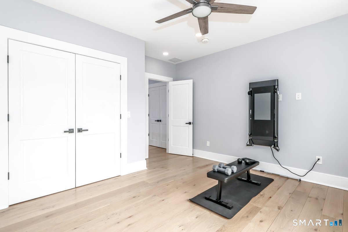 2 Pond View Lane Sherman, CT 06784 - Photo 27 of 40 a room with a window and a ceiling fan