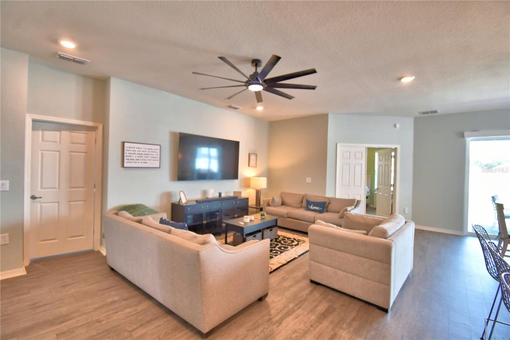 4340 Reding Way Lakeland, FL 33813 - Photo 11 of 63 a living room with furniture and a wooden floor
