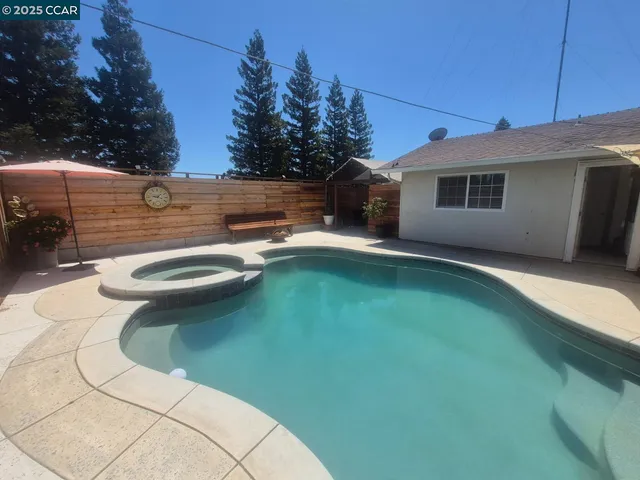 a view of a backyard with sitting area