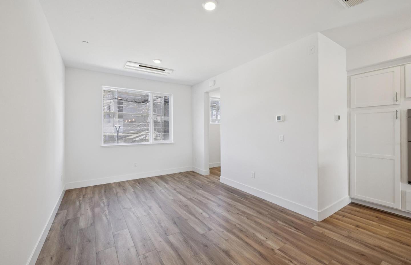 1375 California Circle Milpitas, CA 95035 - Photo 28 of 47 wooden floor in an empty room with a window