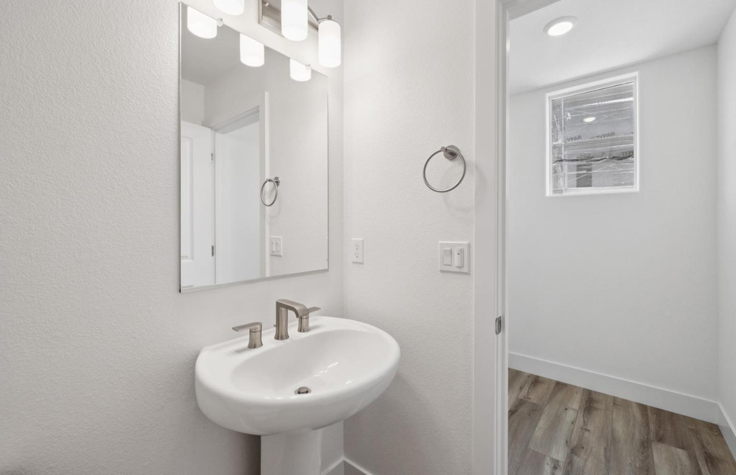 1375 California Circle Milpitas, CA 95035 - Photo 33 of 47 a bathroom with a sink a mirror and shower