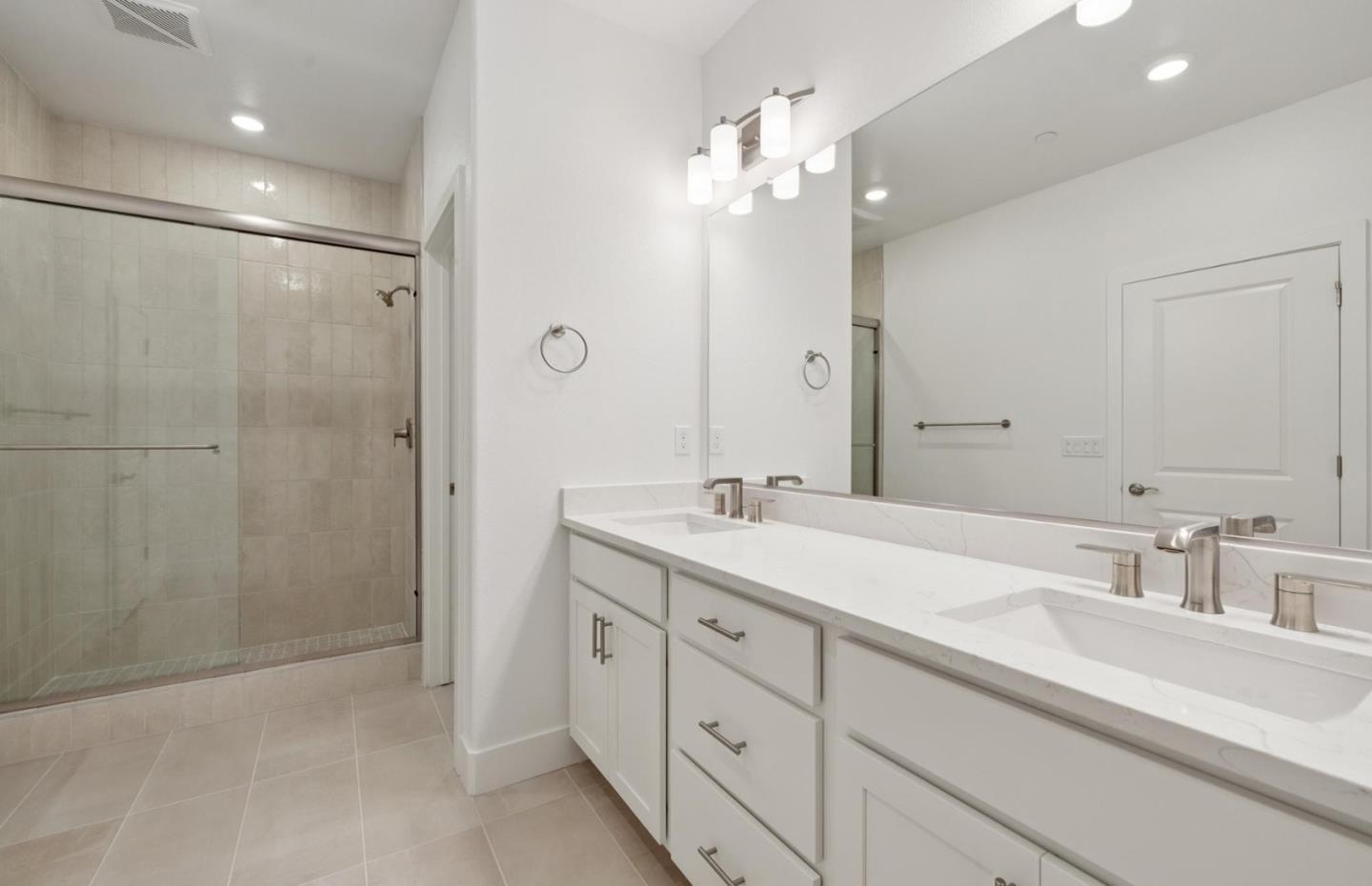 1375 California Circle Milpitas, CA 95035 - Photo 47 of 47 a bathroom with a double vanity sink mirror and shower