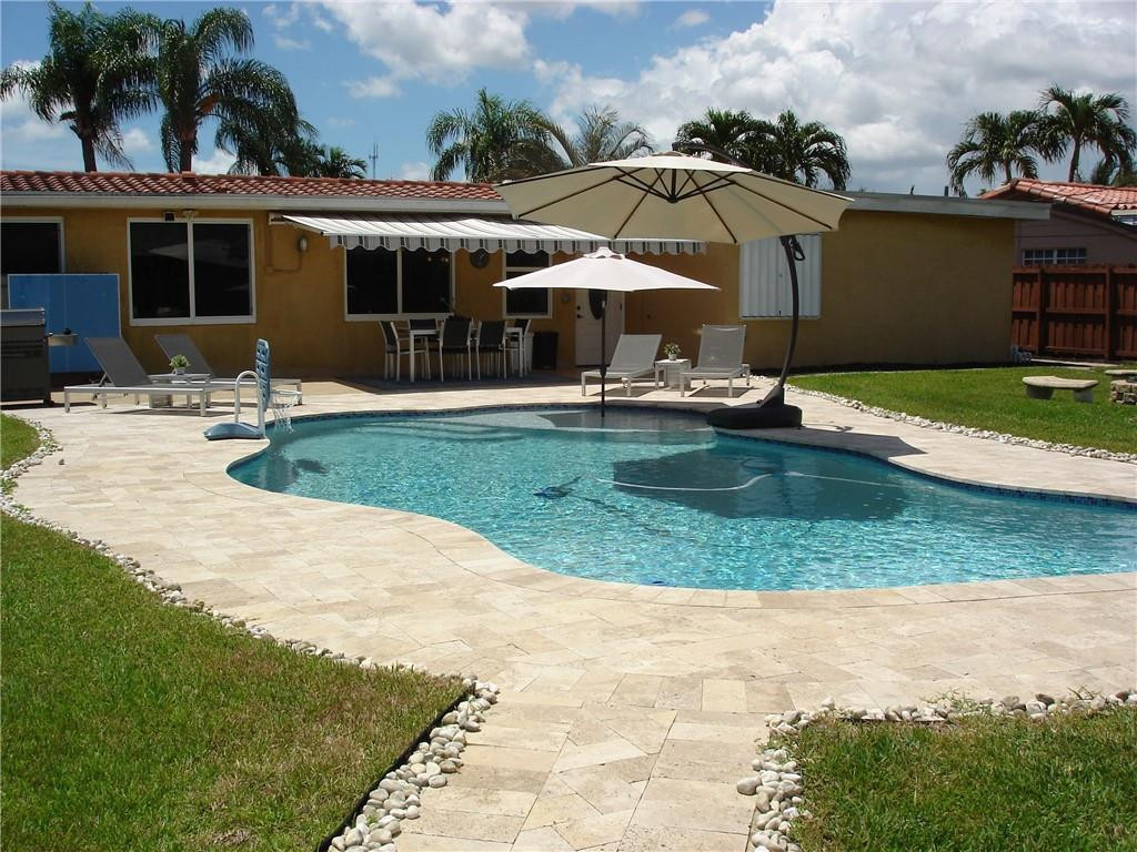 4225 Jackson Street Hollywood, FL 33021 - Photo 1 of 25 a view of a house with swimming pool and porch