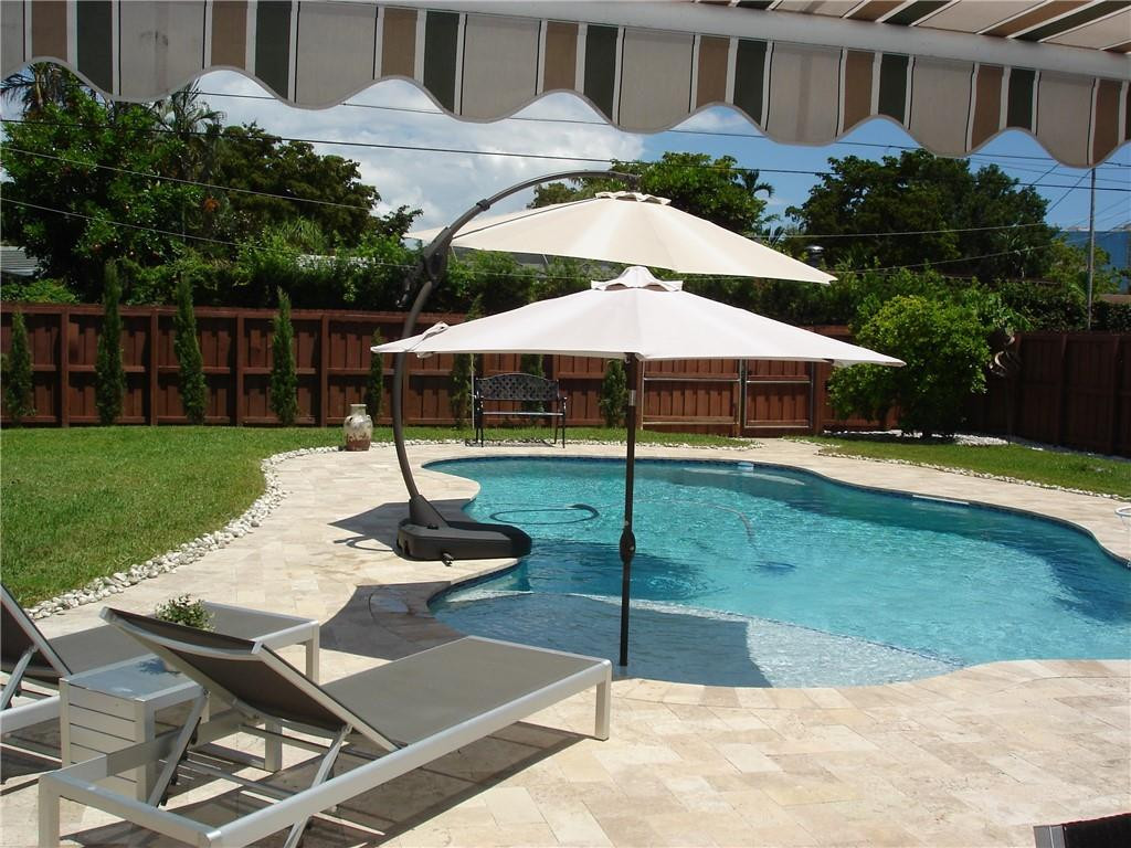 4225 Jackson Street Hollywood, FL 33021 - Photo 11 of 25 a swimming pool with an outdoor seating