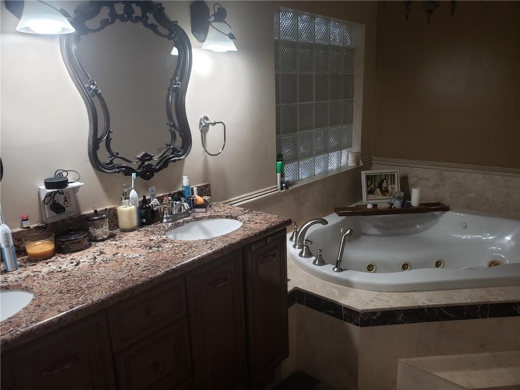 4225 Jackson Street Hollywood, FL 33021 - Photo 17 of 25 a bathroom with a sink and a mirror