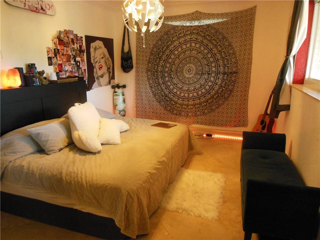 4225 Jackson Street Hollywood, FL 33021 - Photo 18 of 25 a bed sitting in a bedroom next to a window