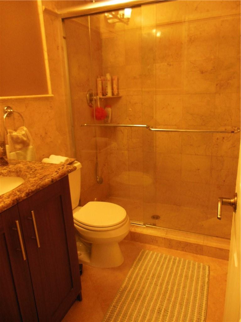 4225 Jackson Street Hollywood, FL 33021 - Photo 19 of 25 a bathroom with a toilet and a shower