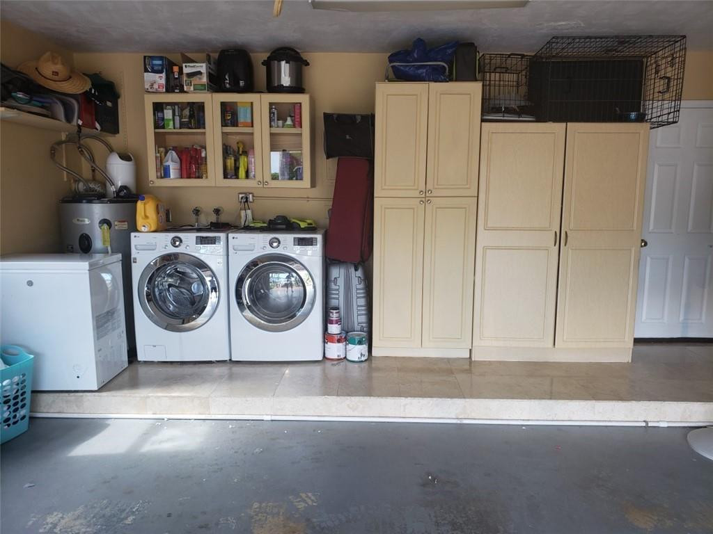 4225 Jackson Street Hollywood, FL 33021 - Photo 25 of 25 a utility room with closet dryer and washer