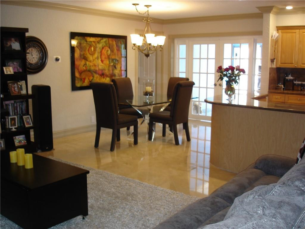 4225 Jackson Street Hollywood, FL 33021 - Photo 6 of 25 a view of a dining room with furniture and chandelier