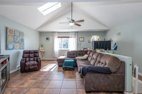 a living room with furniture and a window