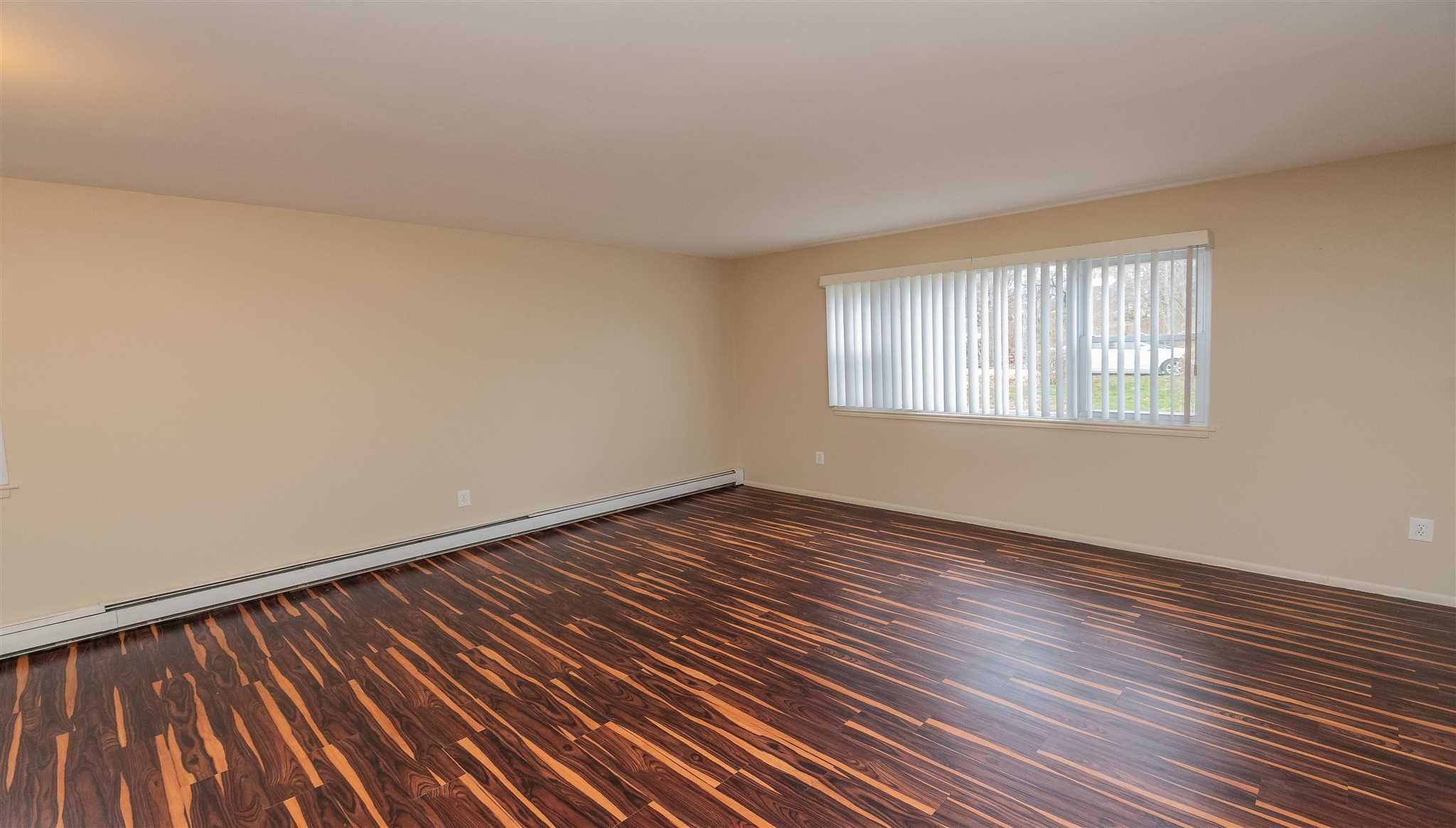 6 McGrath Terrace Fishkill, NY 12524 - Photo 11 of 38 a view of an empty room with wooden floor and window