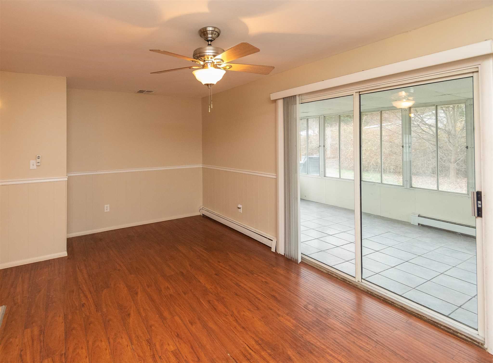 6 McGrath Terrace Fishkill, NY 12524 - Photo 16 of 38 wooden floor in an empty room with a window