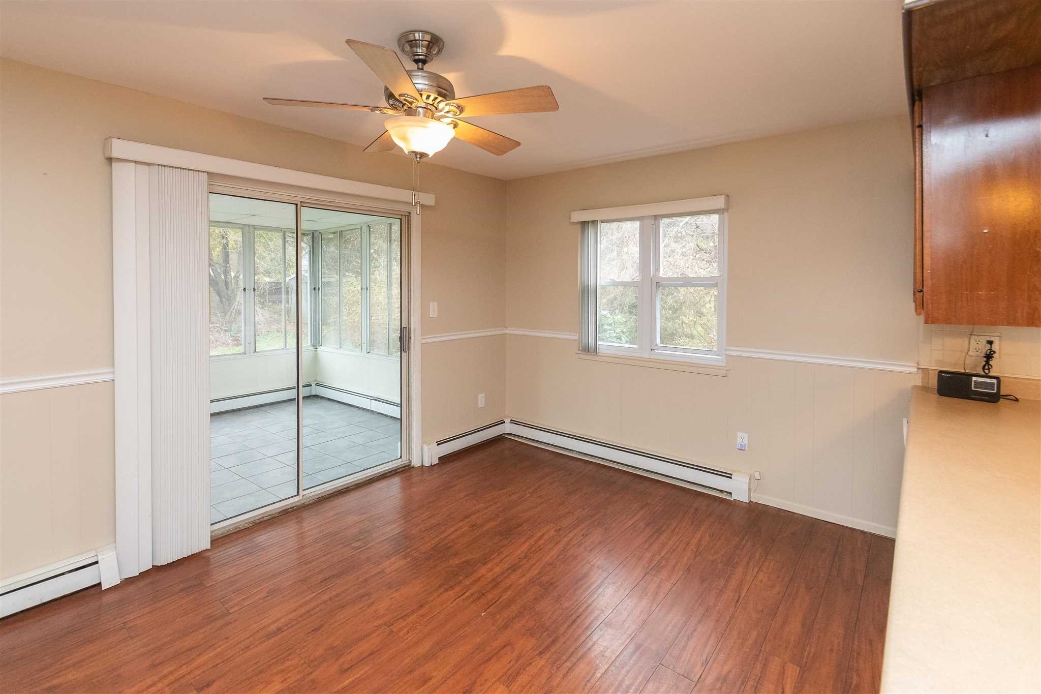6 McGrath Terrace Fishkill, NY 12524 - Photo 17 of 38 an empty room with wooden floor and windows