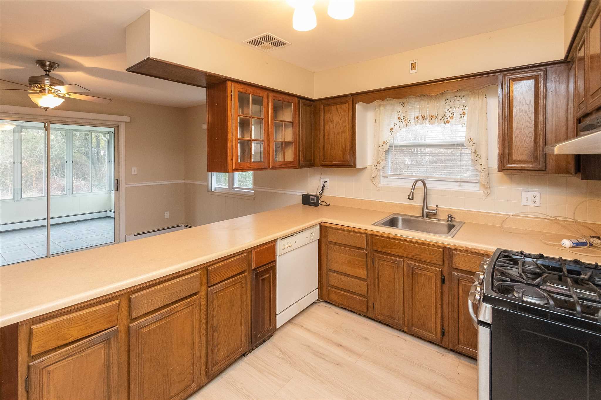 6 McGrath Terrace Fishkill, NY 12524 - Photo 20 of 38 a kitchen with a sink stove and cabinets