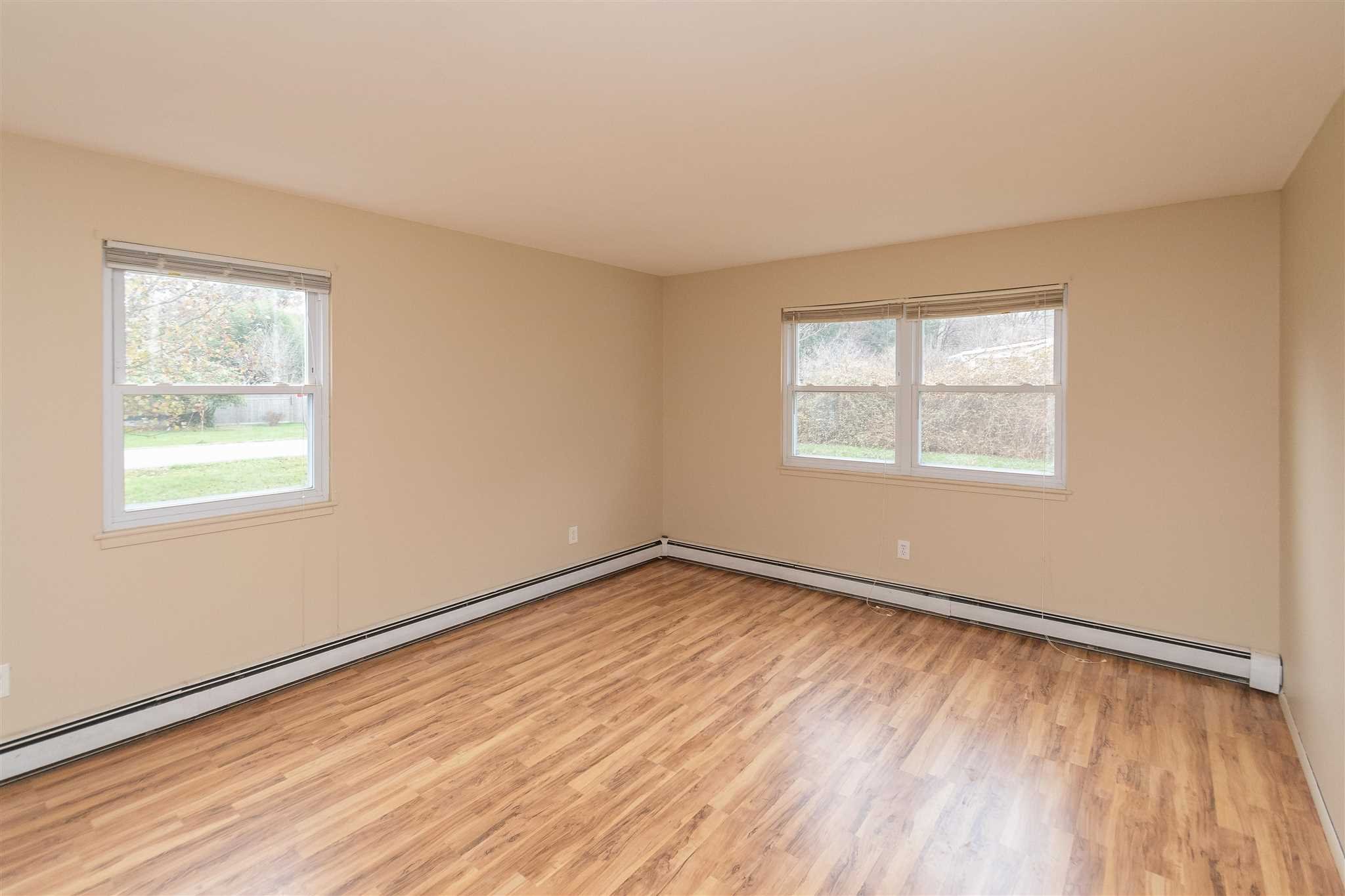 6 McGrath Terrace Fishkill, NY 12524 - Photo 29 of 38 a view of an empty room with wooden floor and a window