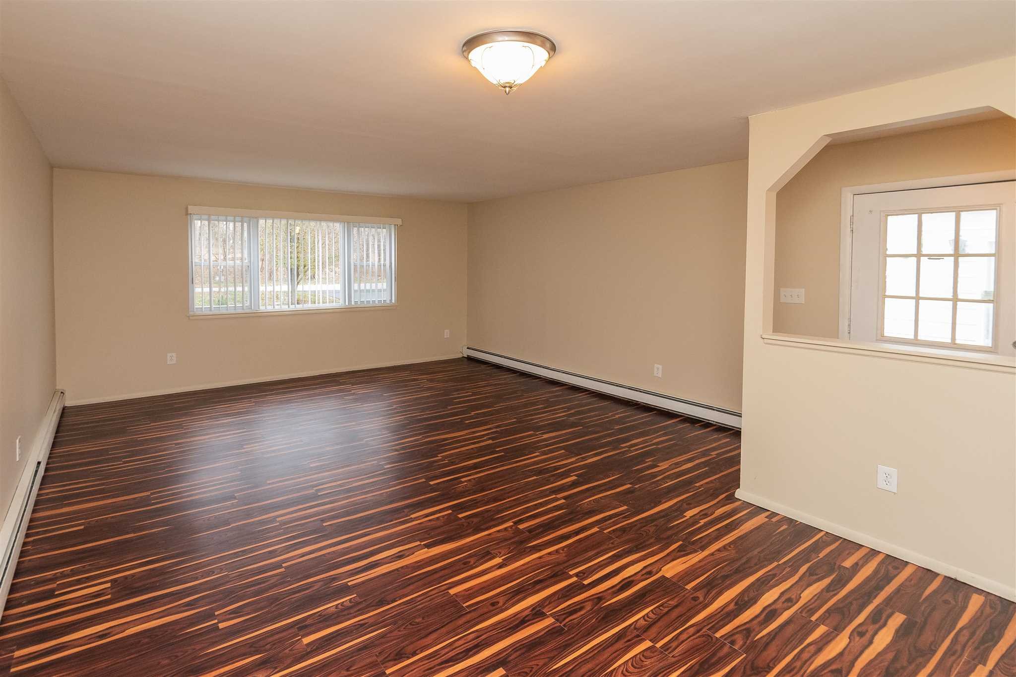 6 McGrath Terrace Fishkill, NY 12524 - Photo 10 of 38 wooden floor in an empty room with a window