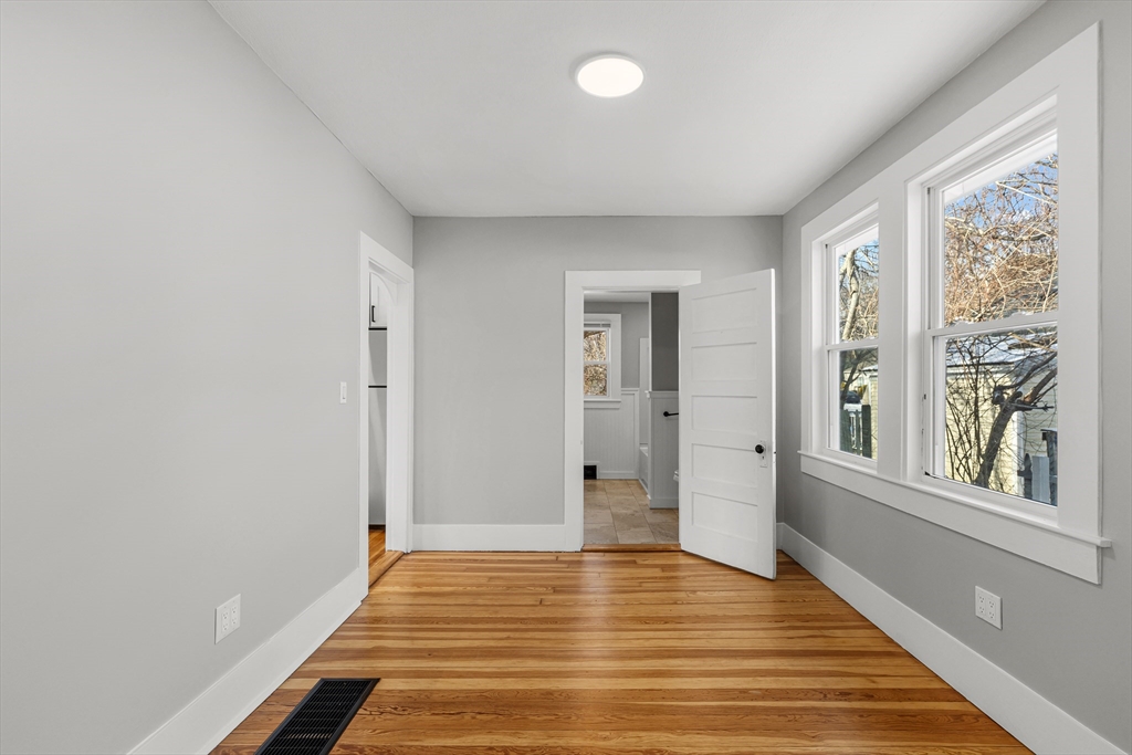 2 Oakdale Street Wareham, MA 02571 - Photo 16 of 33 a view of an empty room with wooden floor and a window