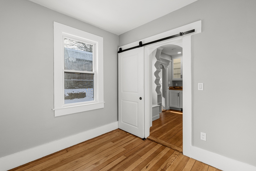 2 Oakdale Street Wareham, MA 02571 - Photo 24 of 33 a view of hallway with wooden floor and a window