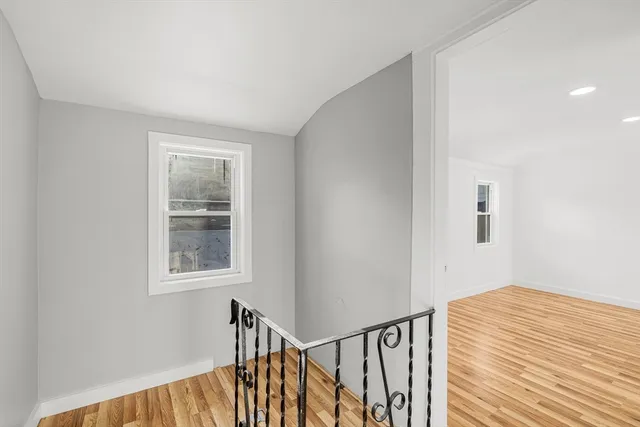 a view of a hallway with windows