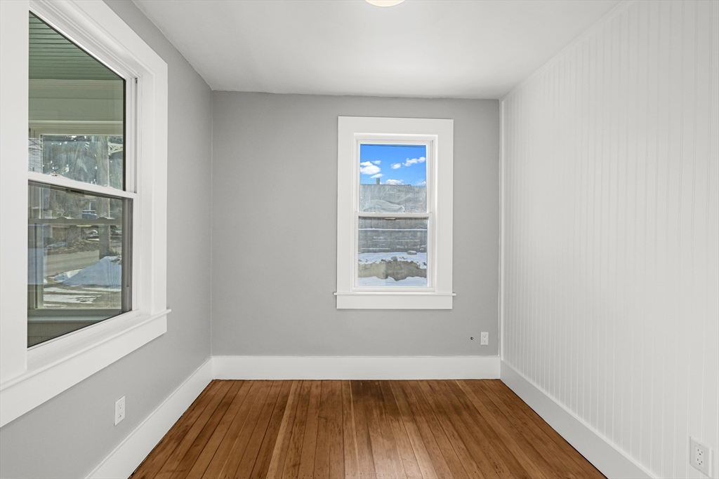 2 Oakdale Street Wareham, MA 02571 - Photo 10 of 33 an empty room with a window and wooden floor